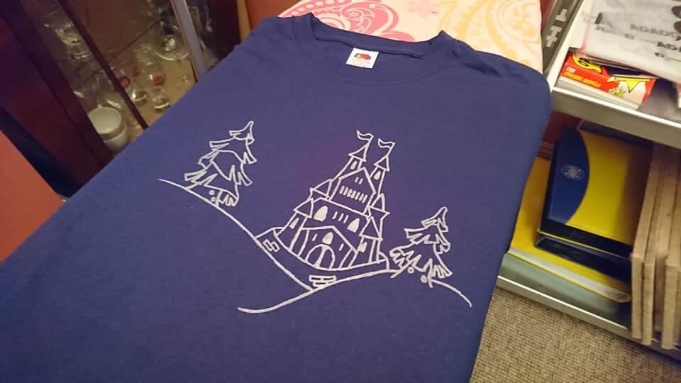 Front of t-shirt with castle and trees design 